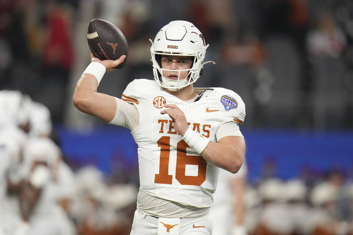 Texas quarterback Arch Manning warms up before the Cotton Bowl College Football Playoff semifin ...