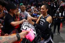 Aces center A'ja Wilson (22) signs autographs after reaching 5,000 career points in a win over ...
