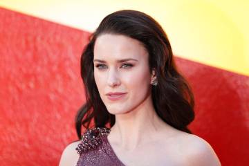 Rachel Brosnahan poses for photographers upon arrival at a fan screening of Superman, on Wednes ...