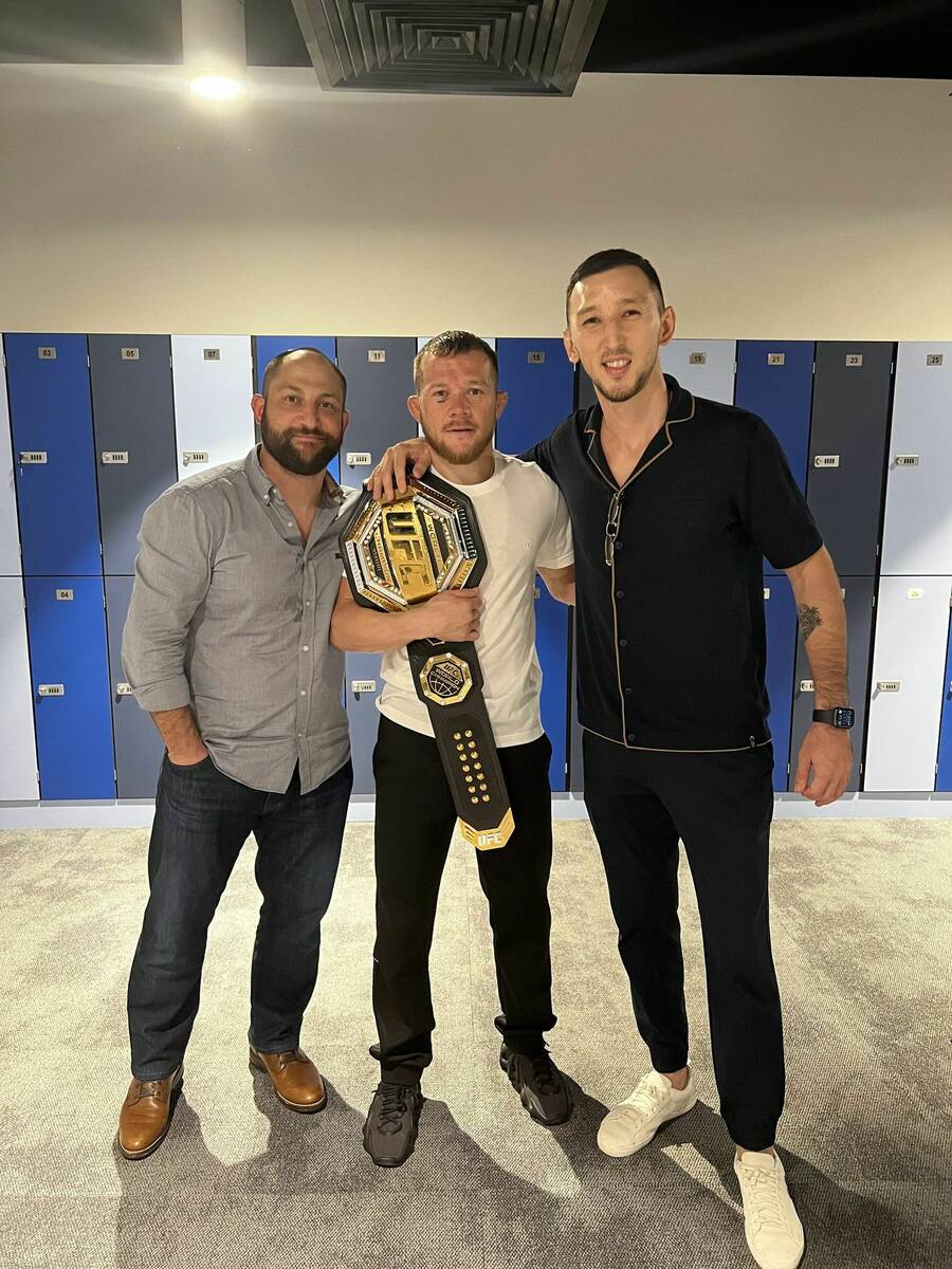 Daniel Rubenstein (left), Petr Yan and Ruby Sports & Entertainment agent Sayat Abdrakhmanov. (R ...