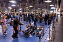 Travelers wind their way to a TSA security checkpoint in Terminal One at Harry Reid Internation ...