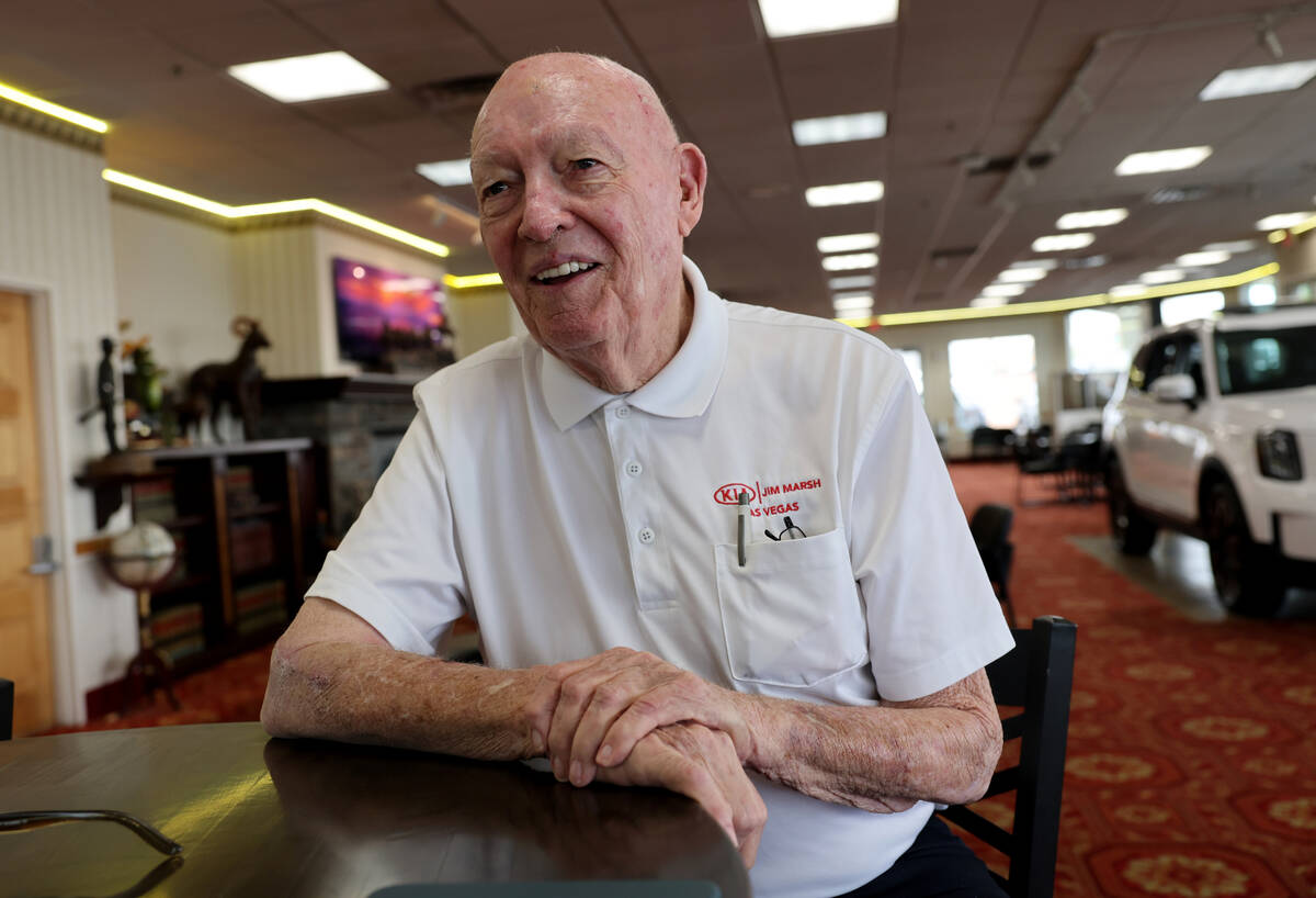 Car dealer Jim Marsh, who also holds several gaming licenses with rural casinos, talks to a rep ...