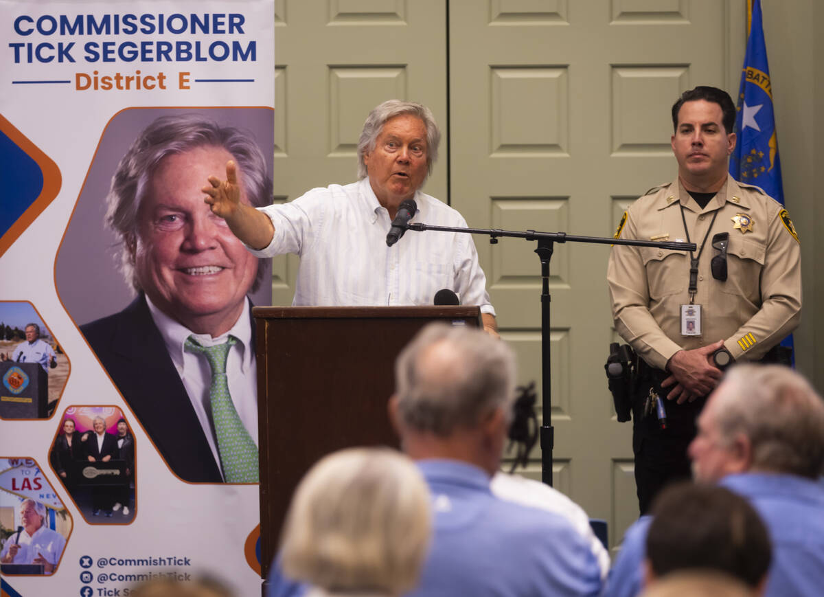 Clark County Commissioner Tick Segerblom speaks alongside Metropolitan Police Department Capt. ...