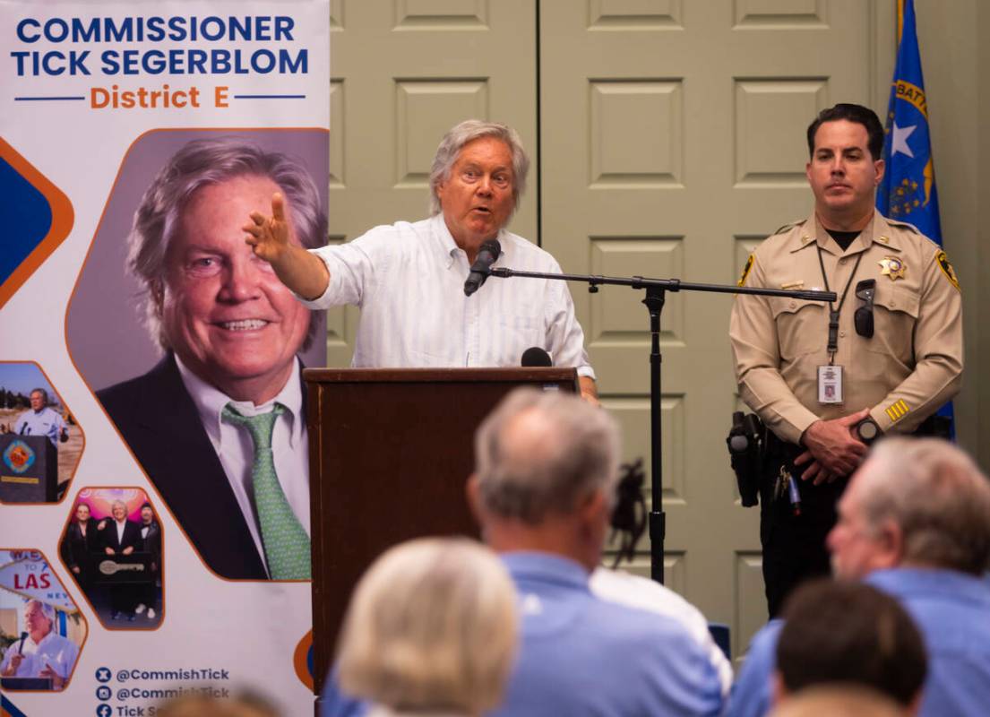 Clark County Commissioner Tick Segerblom speaks alongside Metropolitan Police Department Capt. ...