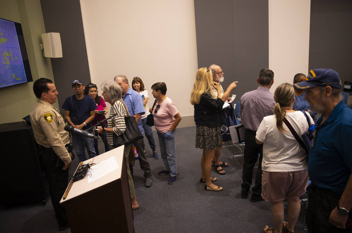 Attendees line up to speak with Metropolitan Police Department Capt. Landon Reyes, of South Cen ...