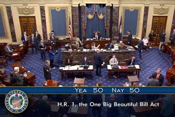 In this image from video from Senate Television, Vice President JD Vance, seated center, breaks ...