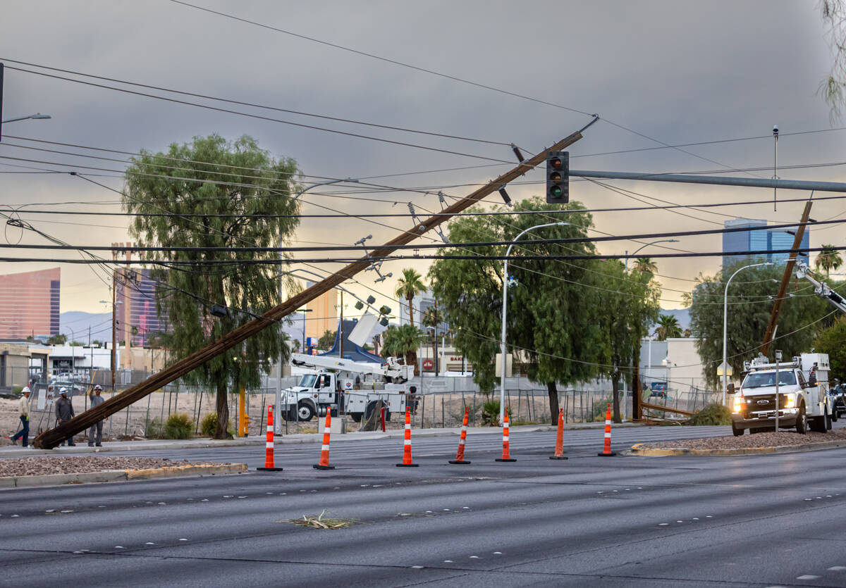 Utility crews respond to downed power lines along Sahara Avenue east of Eastern Avenue on Tuesd ...