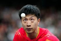 China's Ma Long, with his teammate Wang Chuqin, plays against South Korea's Cho Daeseong and Ja ...