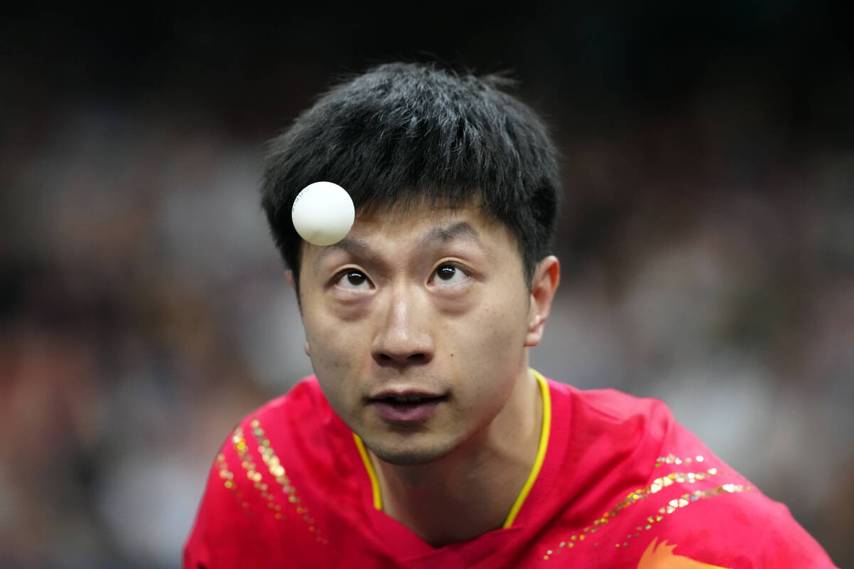 China's Ma Long, with his teammate Wang Chuqin, plays against South Korea's Cho Daeseong and Ja ...