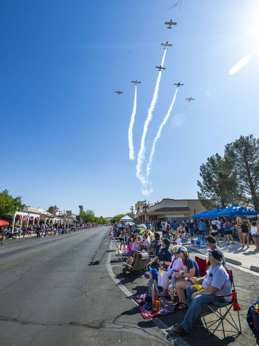 A Boulder City Veterans group conducts a flyover starting off the parade during the 77th Annual ...