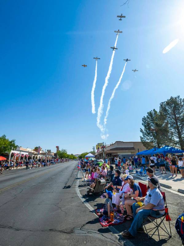 A Boulder City Veterans group conducts a flyover starting off the parade during the 77th Annual ...