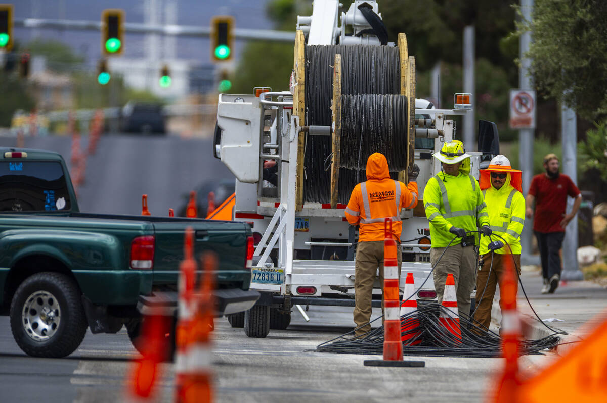 Crews continue on storm damage repair along South Jones Boulevard on Wednesday, July 2, 2025, i ...