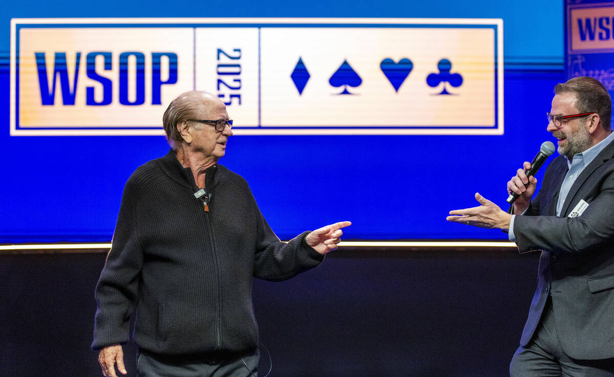 Poker legend Billy Baxter jokes with Jack Effel after announcing the "shuffle up and deal& ...