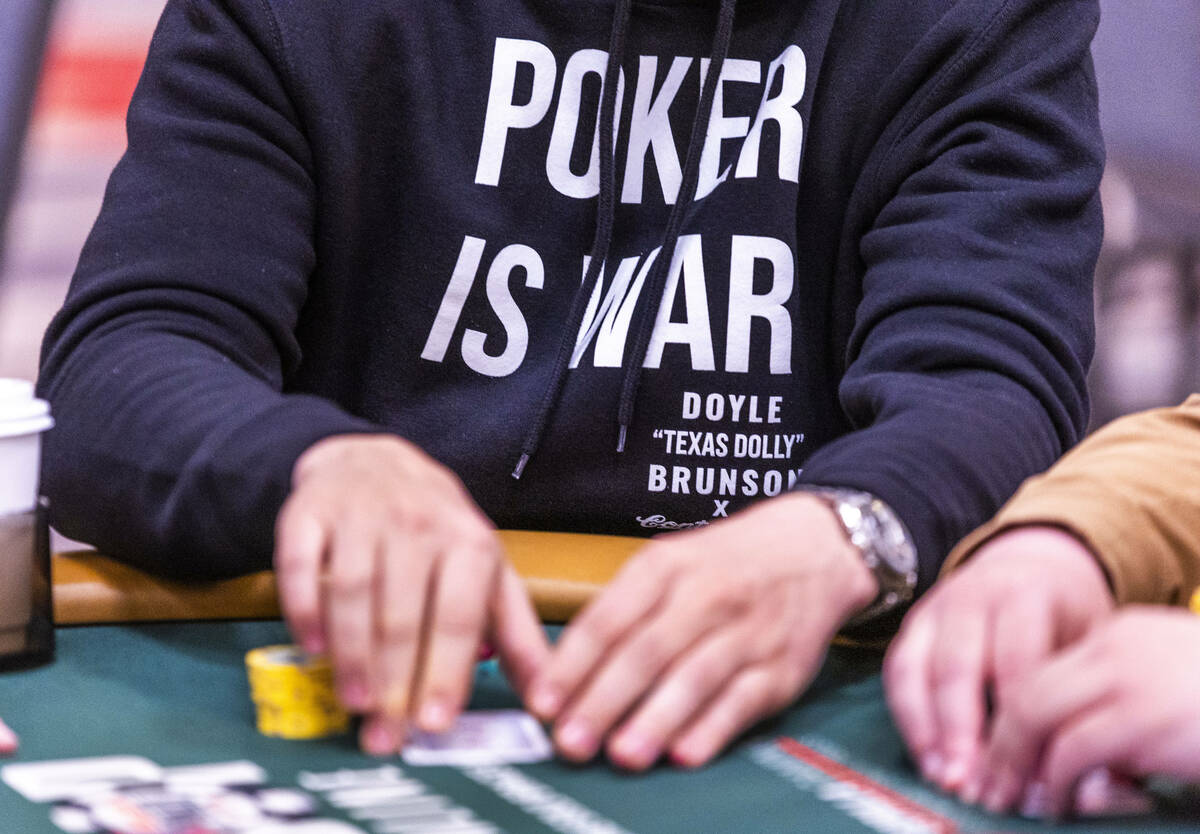 A player wears a "Poker is War" sweatshirt during the opening day of the WSOP Main Ev ...