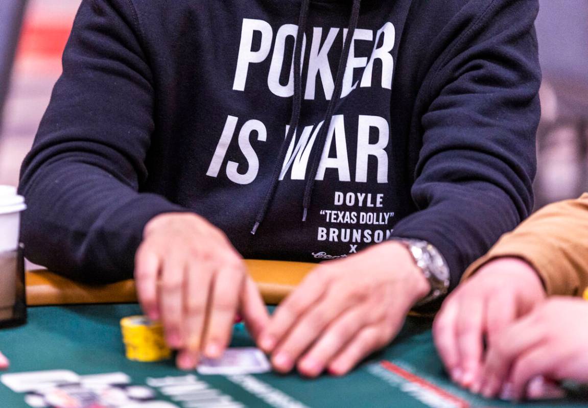 A player wears a "Poker is War" sweatshirt during the opening day of the WSOP Main Ev ...