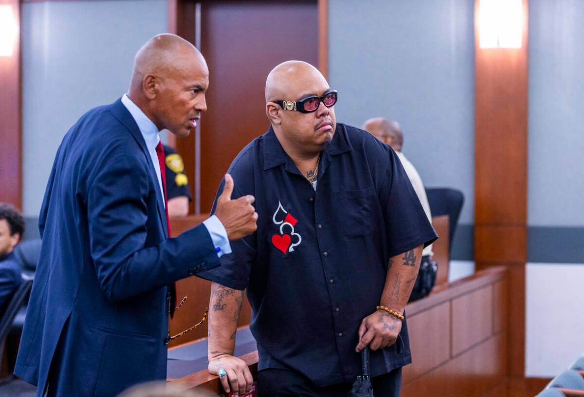 Defense attorney Carl Arnold talks with an observer at the rail as the evidentiary hearing cont ...