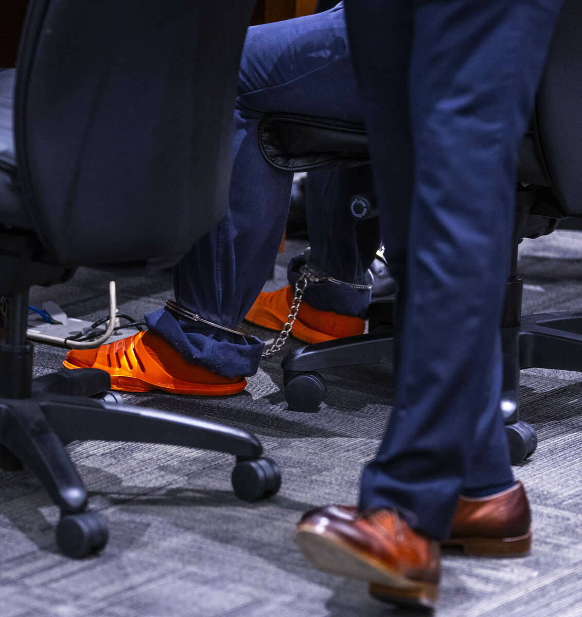 Tupac murder suspect Duane Davis wears ankle cuffs during a hearing on juror misconduct in his ...