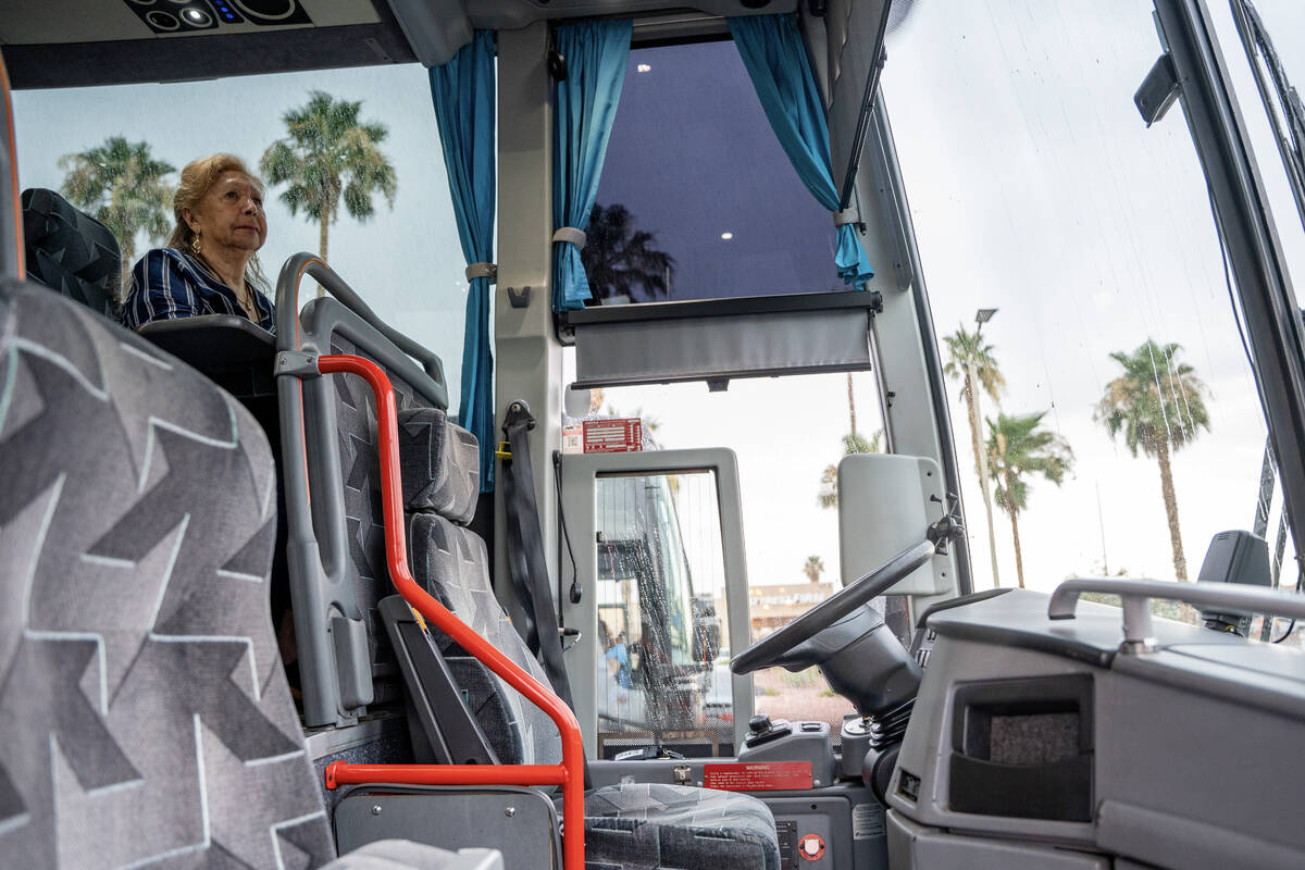 Patty Canales waits in a charter bus which was brought to Holiday Montara Meadows senior living ...