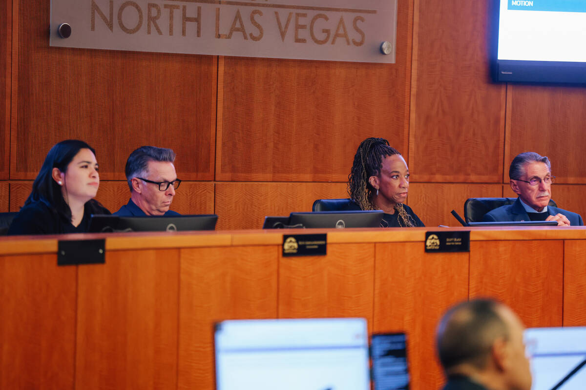 Council members listen to a speaker during a city council meeting and agenda item concerning a ...