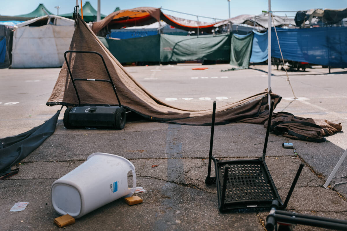 A trashcan and chair sit overturned at one of the many empty stalls at Broadacres Marketplace o ...