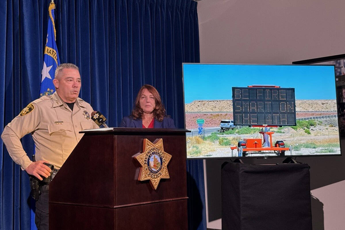 Metropolitan Police Department Undersheriff Andrew Walsh, left, and Clark County Commissioner M ...