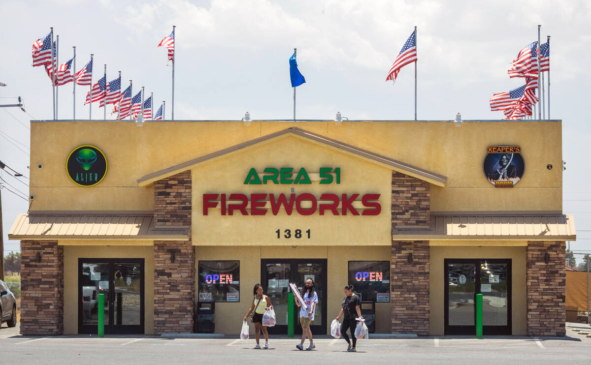 Customers leave Area 51 Fireworks with their purchases on Thursday, July 3, 2025, in Pahrump. ( ...