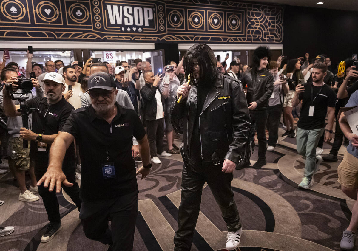 Phil Hellmuth, 17-time World Series of Poker champion, makes his grand entrance for the WSOP Ma ...