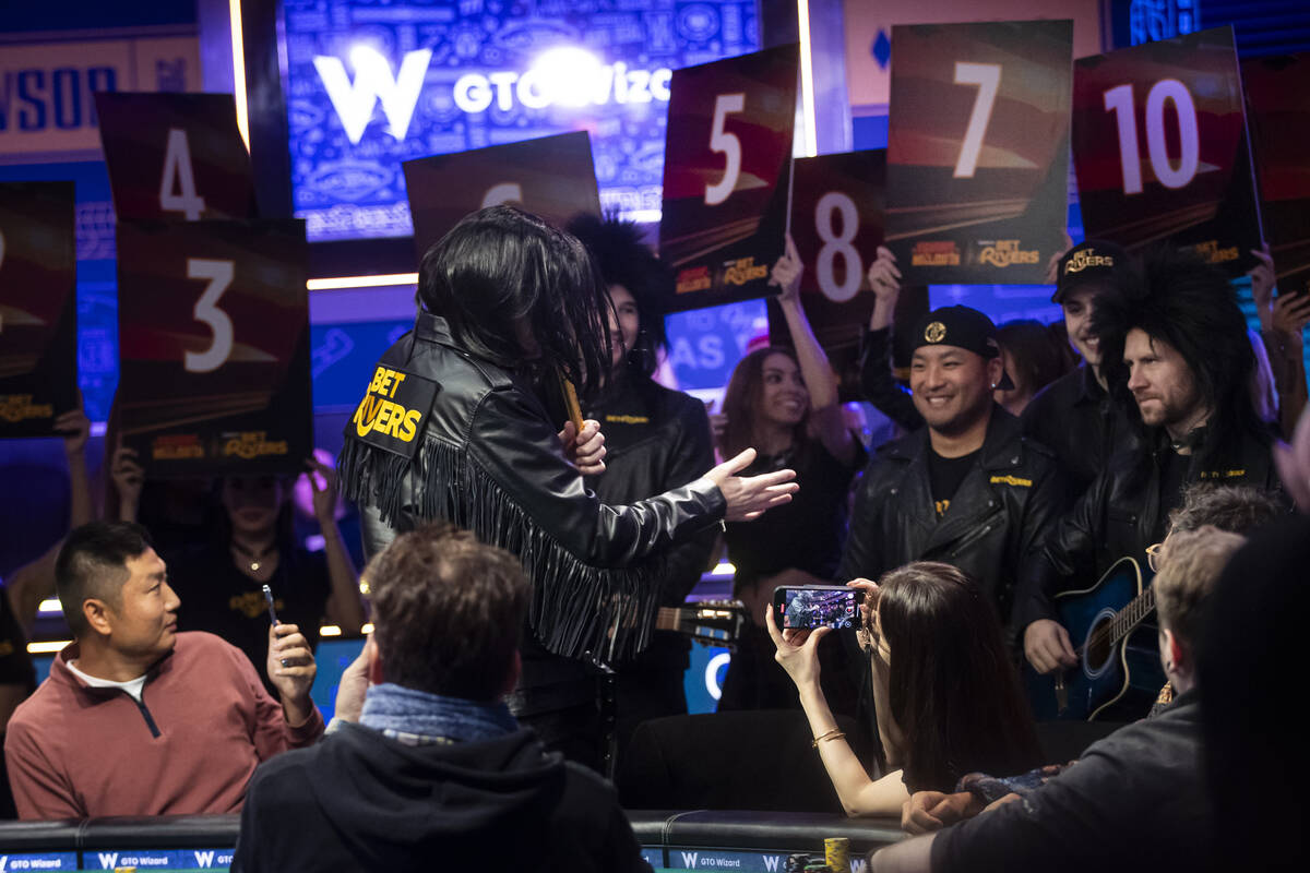 Phil Hellmuth, 17-time World Series of Poker champion, addresses his entourage after making his ...