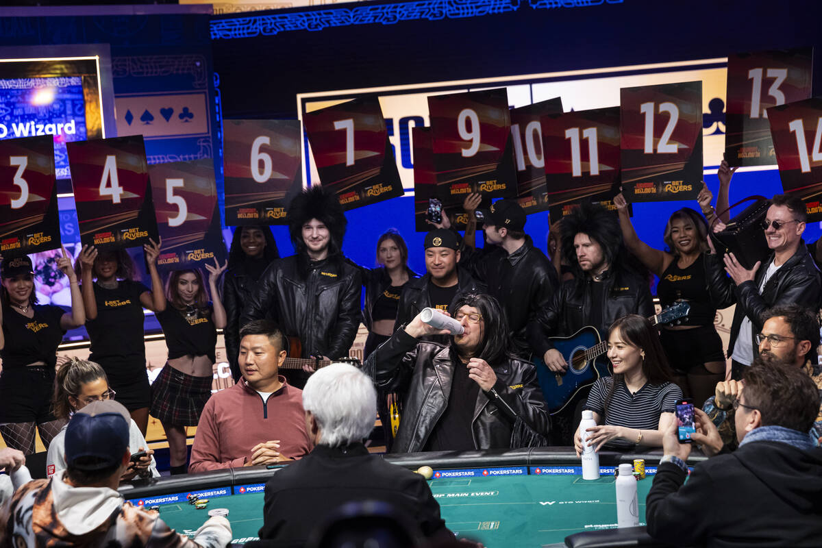 Phil Hellmuth, 17-time World Series of Poker champion, takes a drink after sitting down followi ...