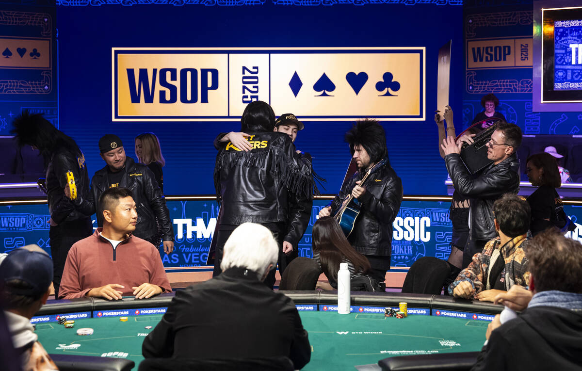 Phil Hellmuth, 17-time World Series of Poker champion, hugs supporters after making his grand e ...