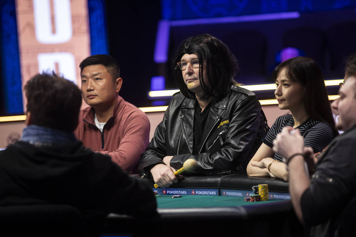 Phil Hellmuth, 17-time World Series of Poker champion, looks on after his grand entrance for th ...