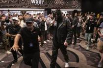 Phil Hellmuth, 17-time World Series of Poker champion, makes his grand entrance for the WSOP Ma ...
