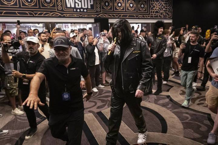 Phil Hellmuth, 17-time World Series of Poker champion, makes his grand entrance for the WSOP Ma ...