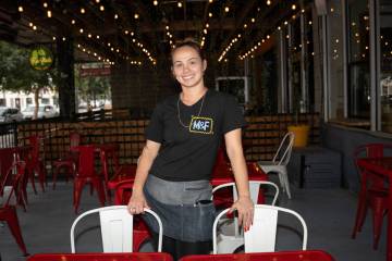 Crystal Chamberlin, a waitress at Makers & Finders, works a shift in Las Vegas July 3, 2025 ...