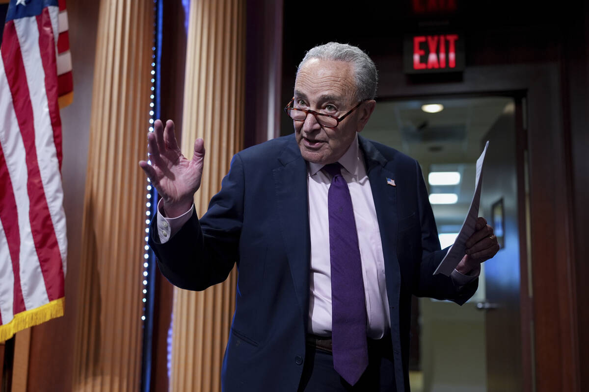 Senate Minority Leader Chuck Schumer, D-N.Y., updates reporters as Senate Republicans work to a ...