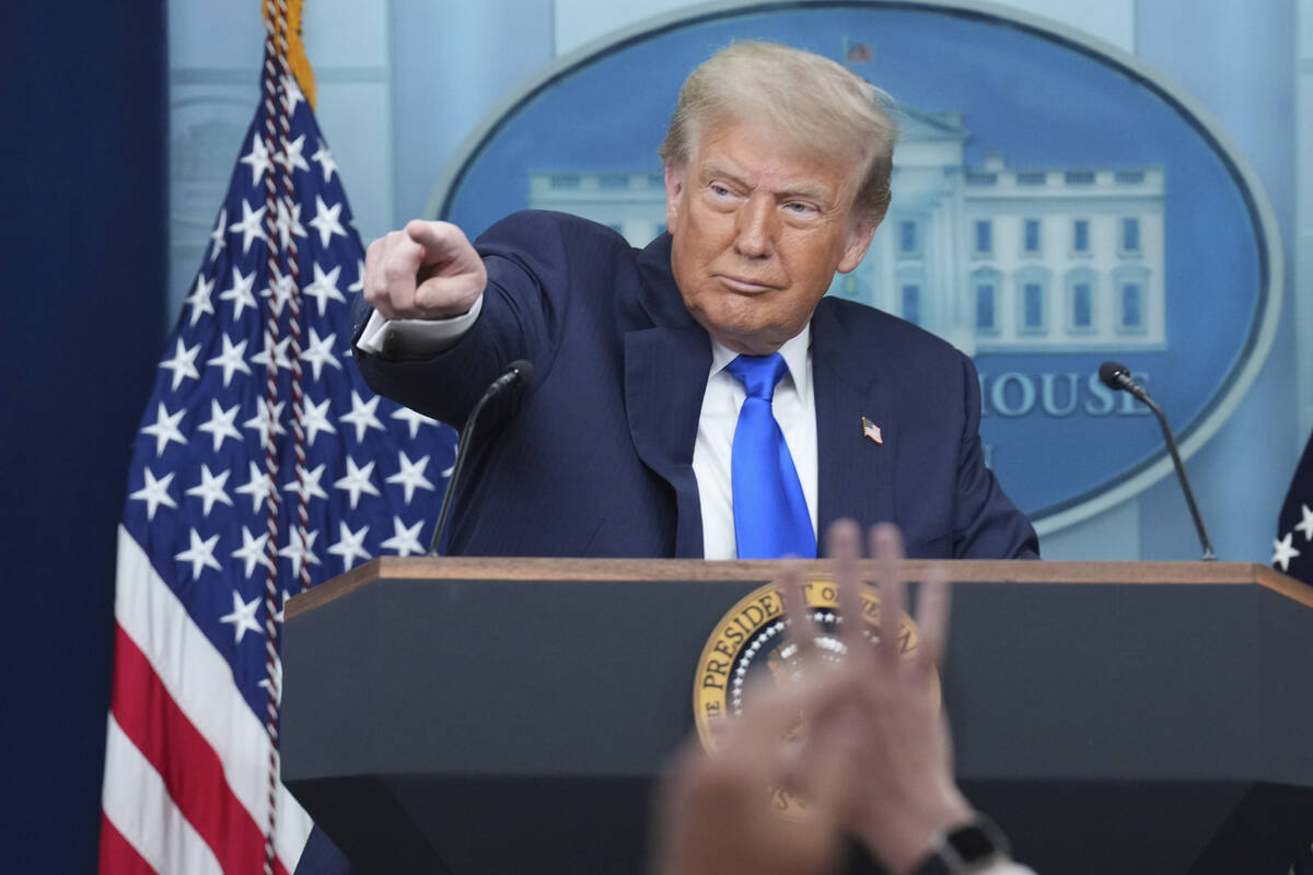 President Donald Trump points to a reporter to take a question as he speaks to the media, Frida ...