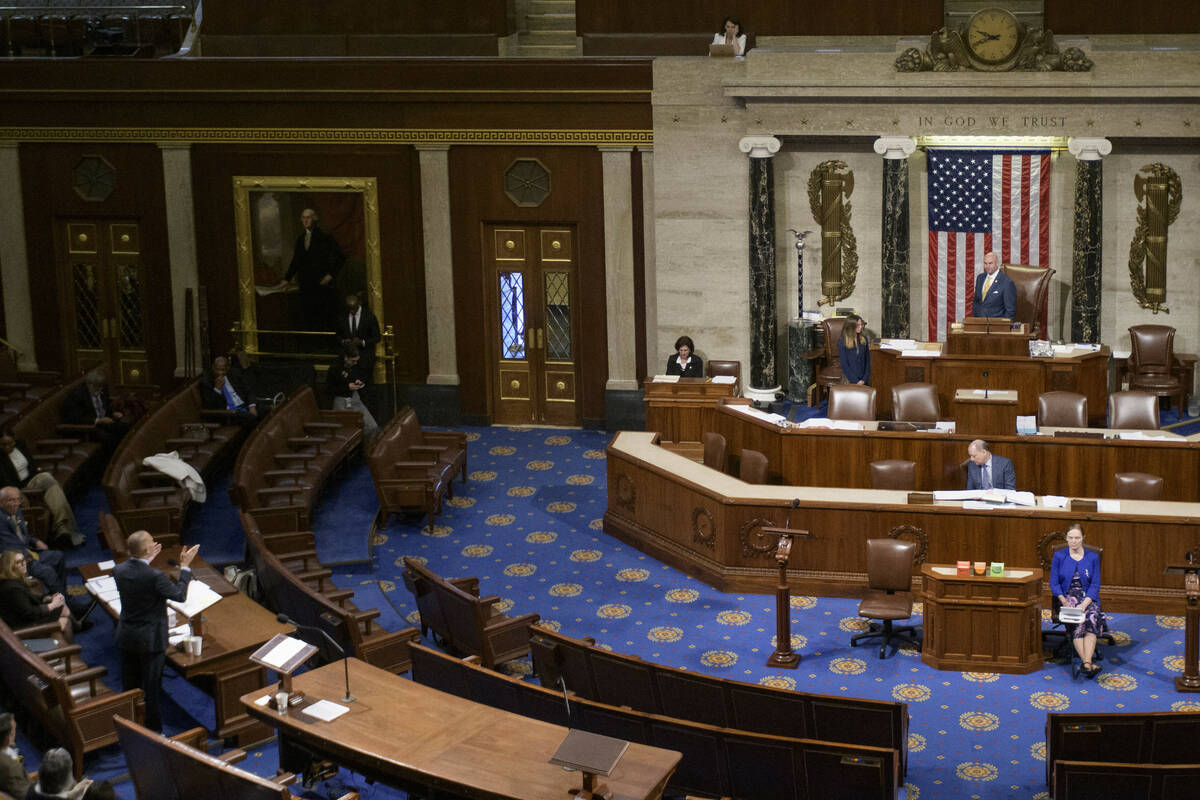House Minority Leader Hakeem Jeffries, D-N.Y., left, speaks in the House chamber prior to the f ...