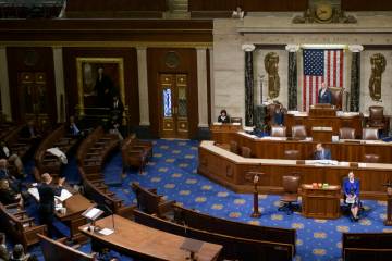 House Minority Leader Hakeem Jeffries, D-N.Y., left, speaks in the House chamber prior to the f ...