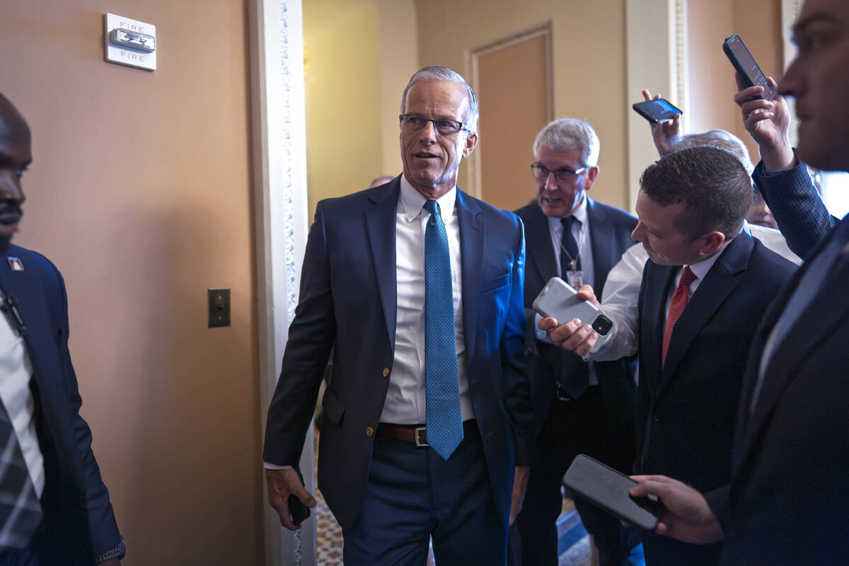 Senate Majority Leader John Thune, R-S.D., arrives for a closed-door Republican meeting to adva ...