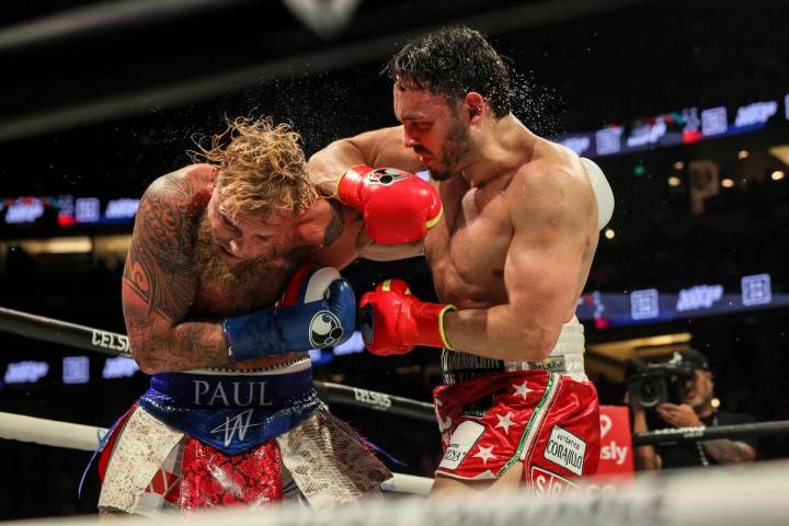Julio Cesar Chavez Jr., right, punches Jake Paul during their cruiserweight boxing match on Sat ...