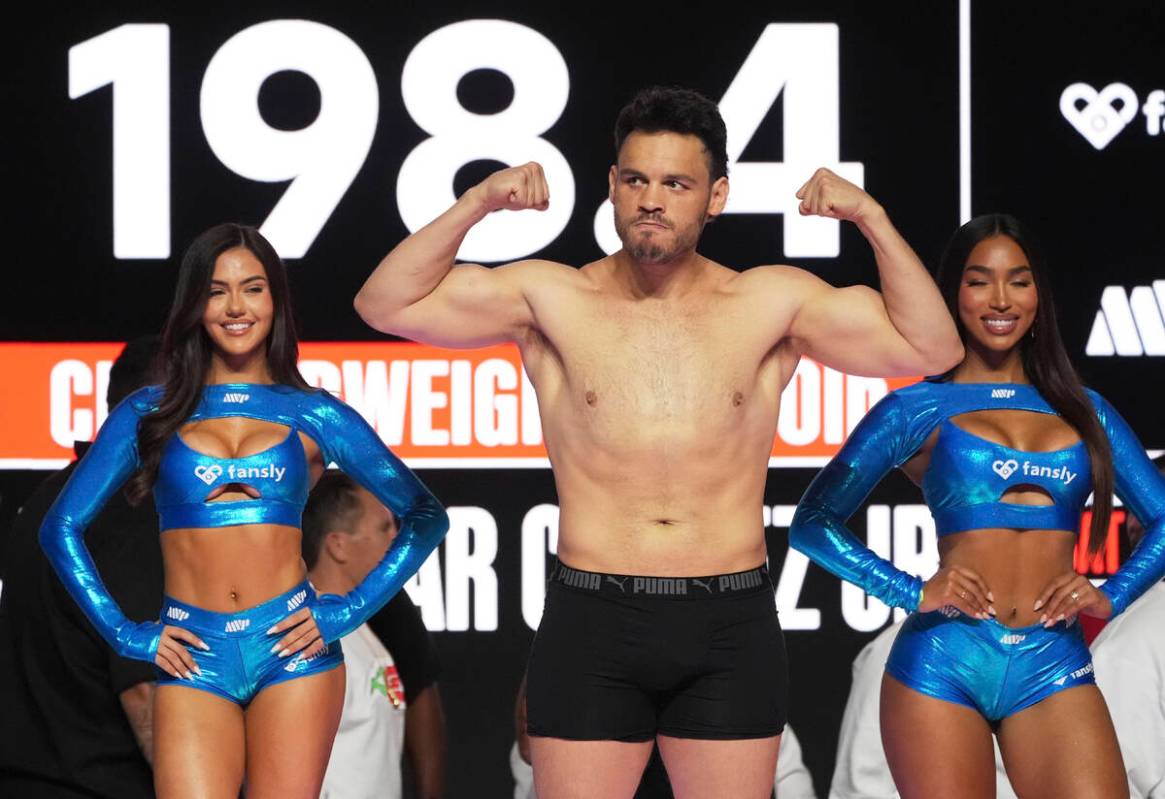 Julio Cesar Chavez Jr., center, poses during a weigh-in ahead of his cruiserweight boxing match ...