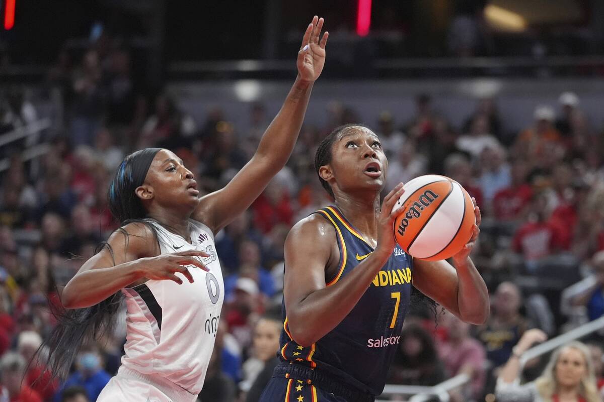 Indiana Fever's Aliyah Boston (7) shoots against Las Vegas Aces' Jackie Young during the first ...
