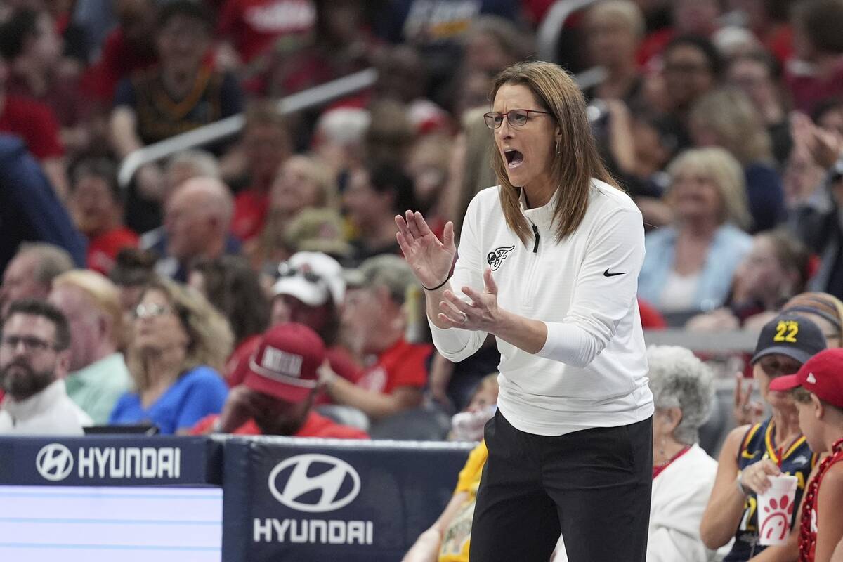 Indiana Fever head coach Stephanie White encourages her team during the second half of a WNBA b ...