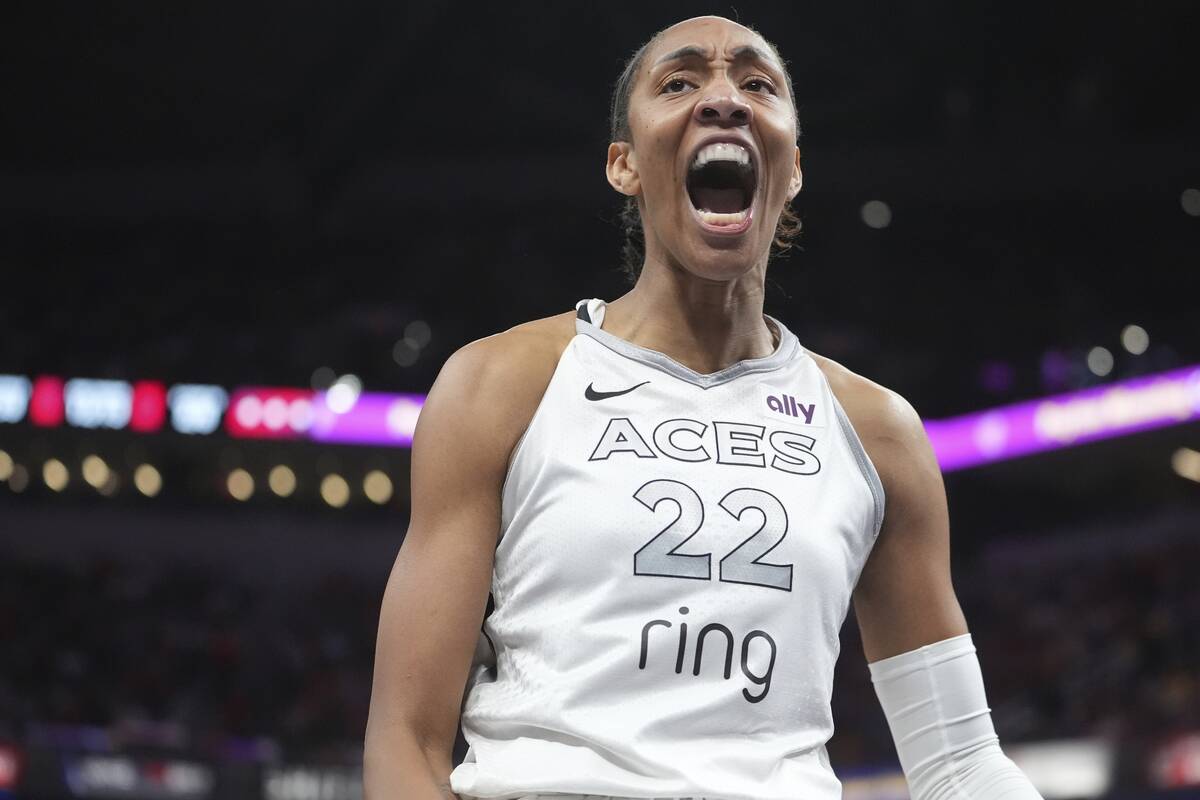 Las Vegas Aces' A'ja Wilson reacts after hitting a shot and getting fouled during the second ha ...