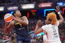 Indiana Fever's Aliyah Boston (7) shoots against Las Vegas Aces' NaLyssa Smith during the first ...