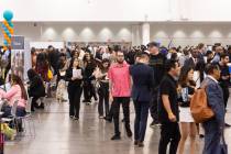 Attendees explore the spring job fair at the Las Vegas Convention Center on Thursday, May 1, 20 ...