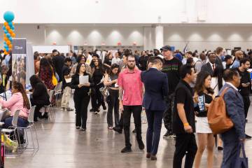 Attendees explore the spring job fair at the Las Vegas Convention Center on Thursday, May 1, 20 ...