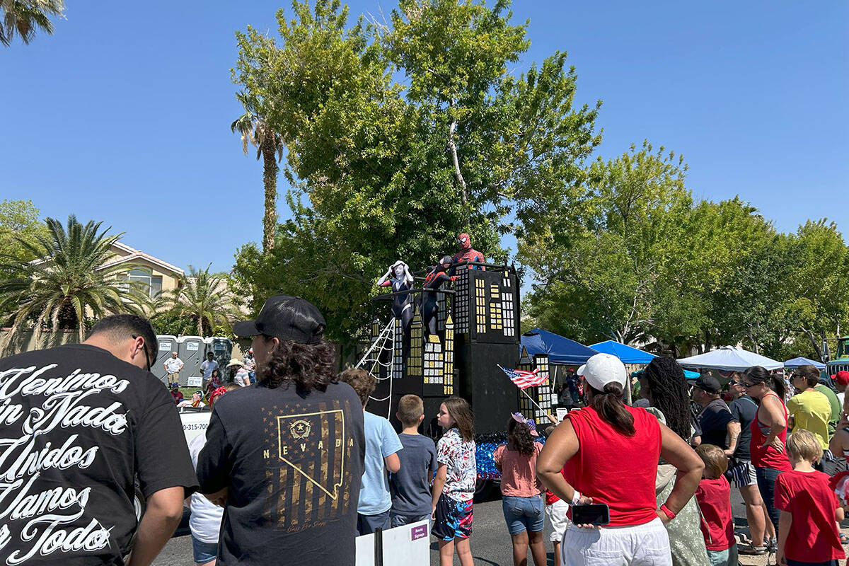 Spider-Man poses while looking at parade attendees at the Summerlin Patriotic Parade on Friday, ...