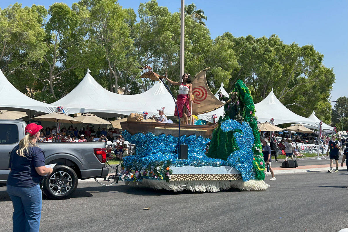 A parade float featuring Moana passes by parade onlookers at the Summerlin Patriotic Parade on ...