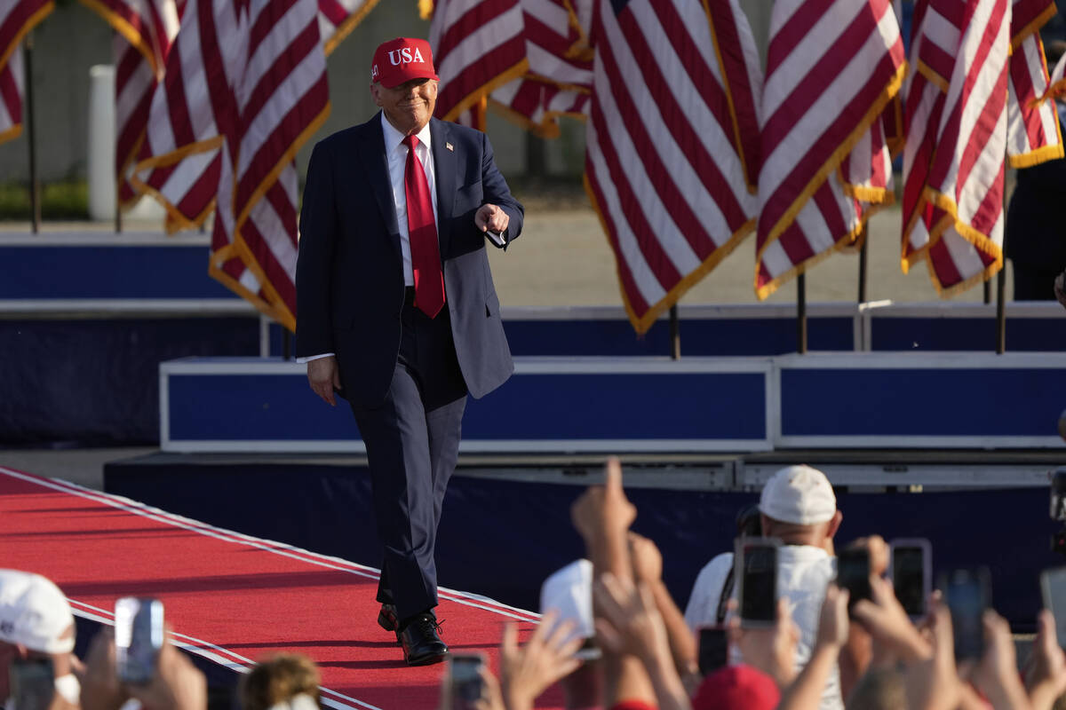 President Donald Trump arrives to speak at a rally at the Iowa State Fairgrounds, Thursday, Jul ...